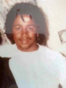 photograph of young man in white tshirt
