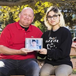 Steve saved Michael's life through donation. Donor sister, Jennifer, and Michael hold his picture