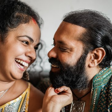 Smiling man and woman looking at each other