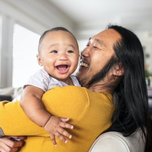 Uncle and nephew smiling and playing