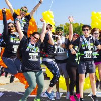 Donate Life Run / Walk Event - Group Celebrating at balloon arch finish